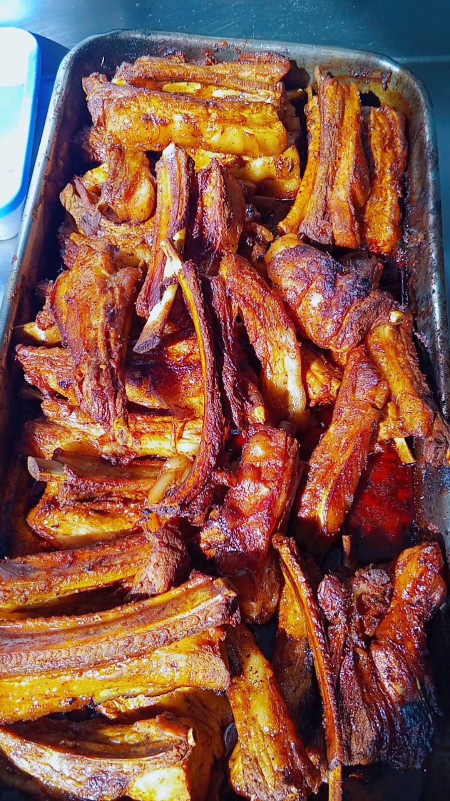 Grilled meat (Nyama Choma) platter with accompaniments
